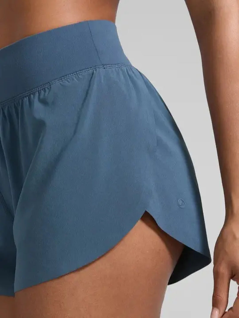 CRZ YOGA Women's High Waisted Dolphin Athletic Running Shorts with 3" High Split and Comfortable Mesh Liner for Gym and Track Workouts
